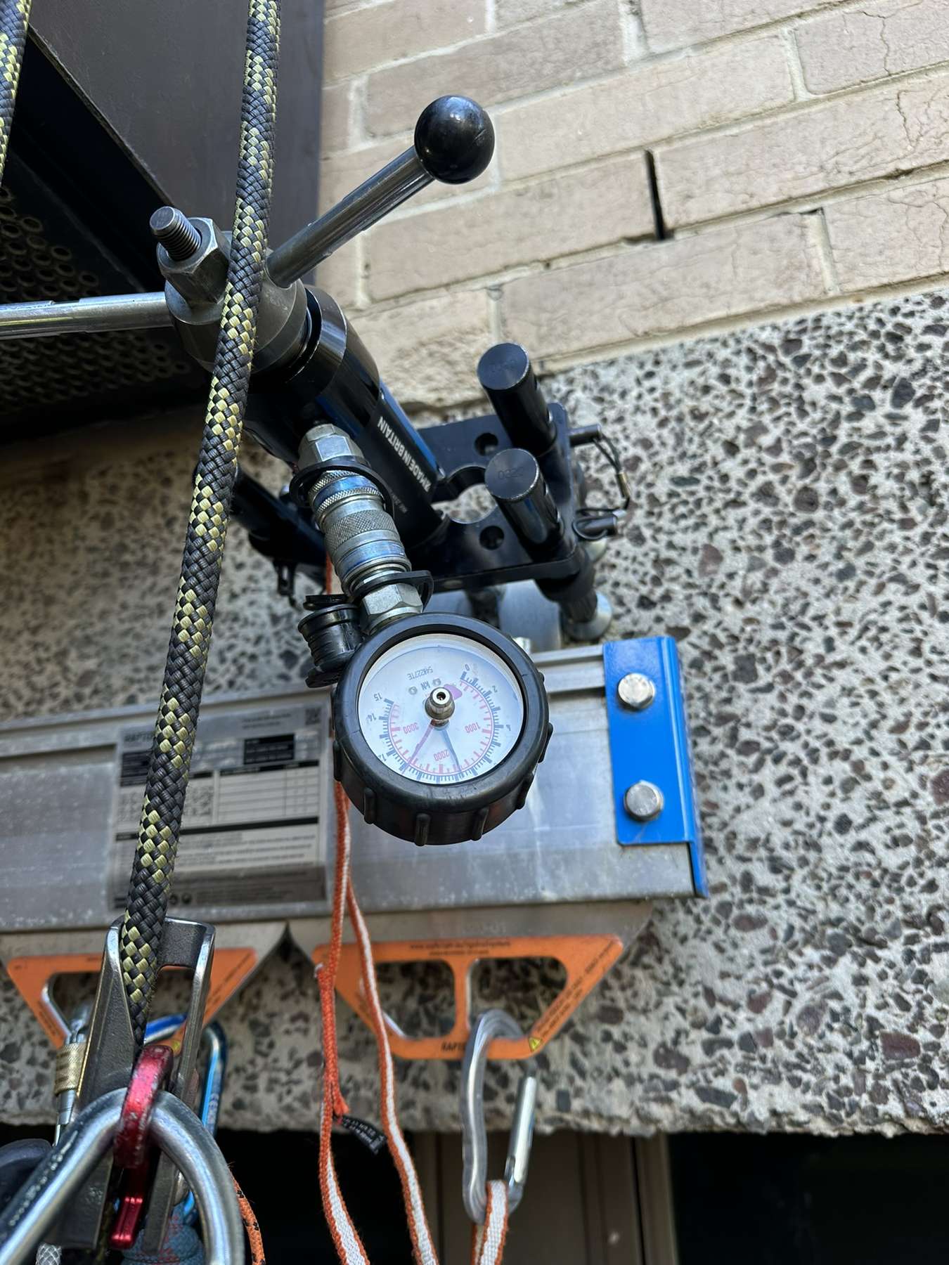 Rope access technician load testing anchor points at height in Melbourne