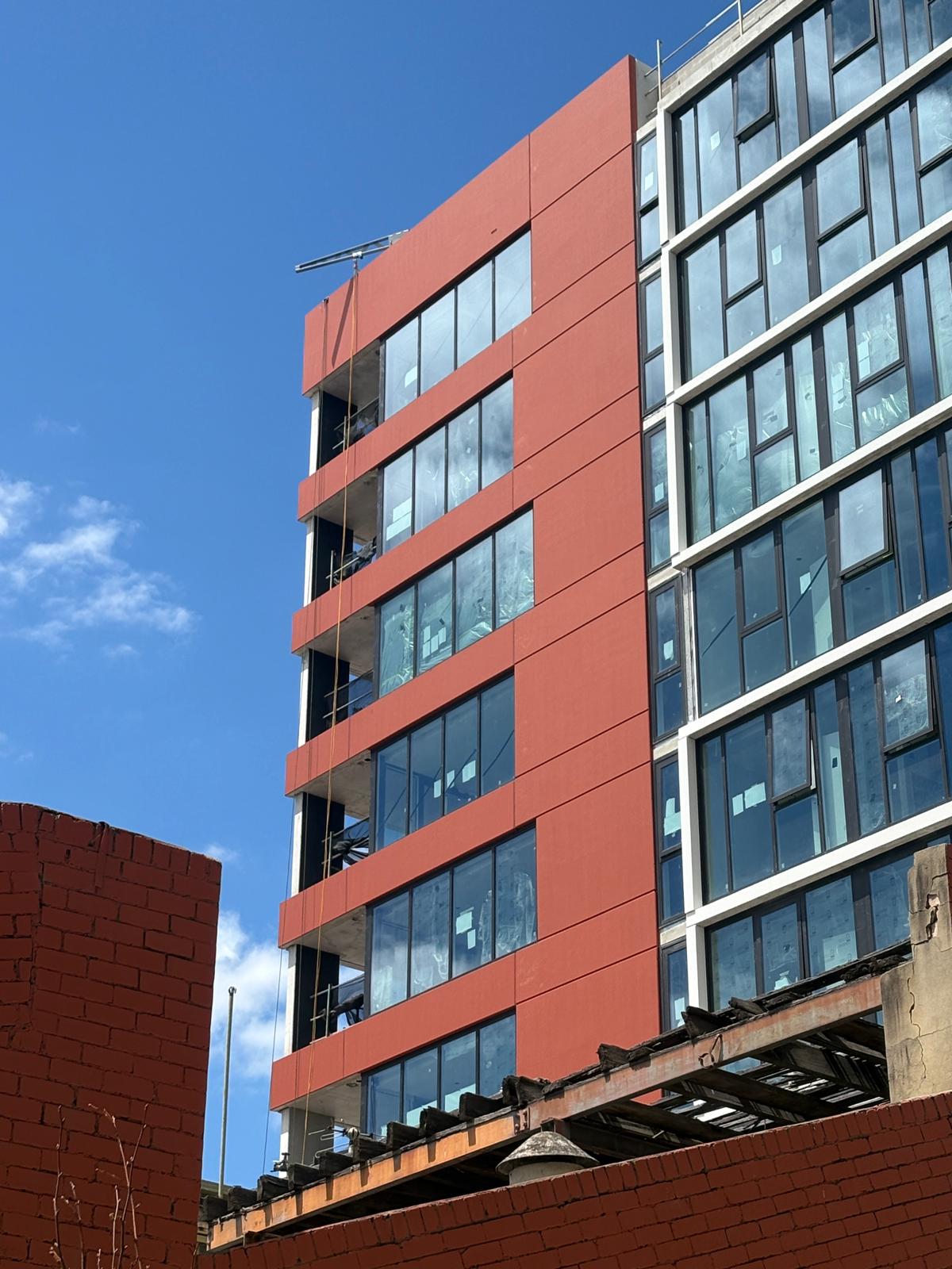 Rope access painting Melbourne commercial building completed facade